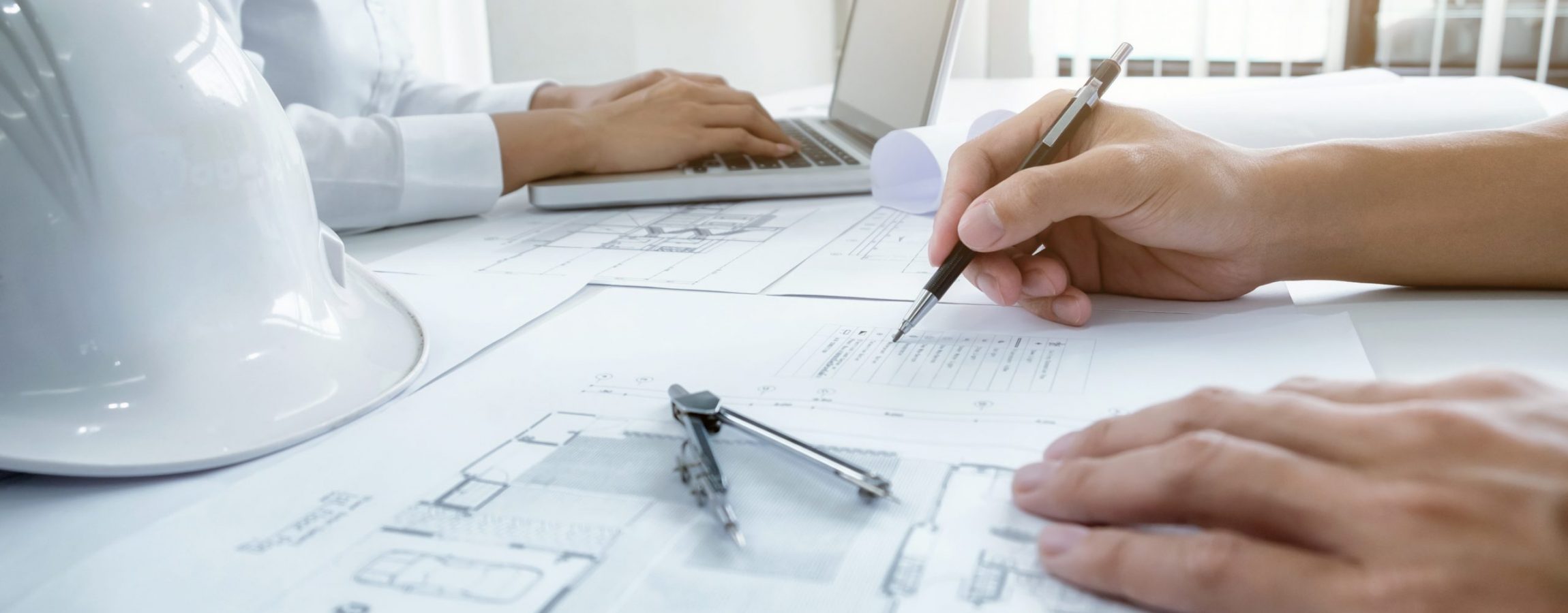 Image of engineer meeting for architectural project. working with partner and engineering tools on workplace vintage tone.